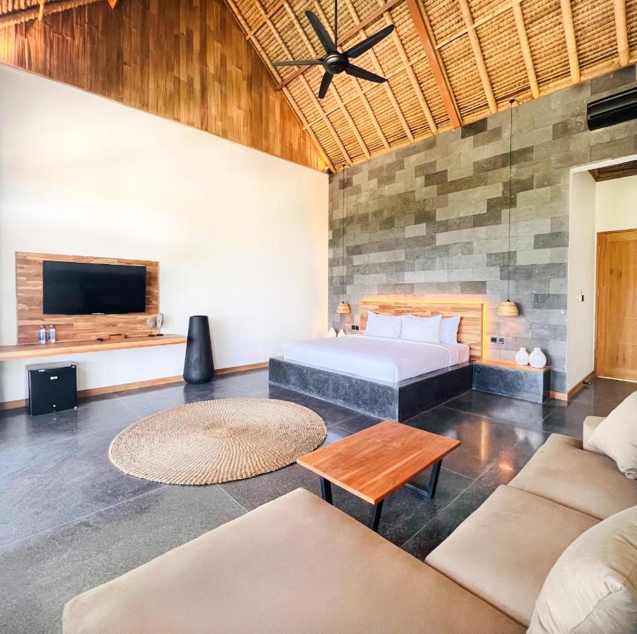 מלון Manggis Neano Escape מראה חיצוני תמונה A bedroom at the resort